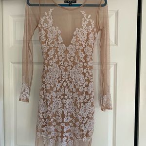 Gorgeous white lace and mesh dress. Subtly sexy.